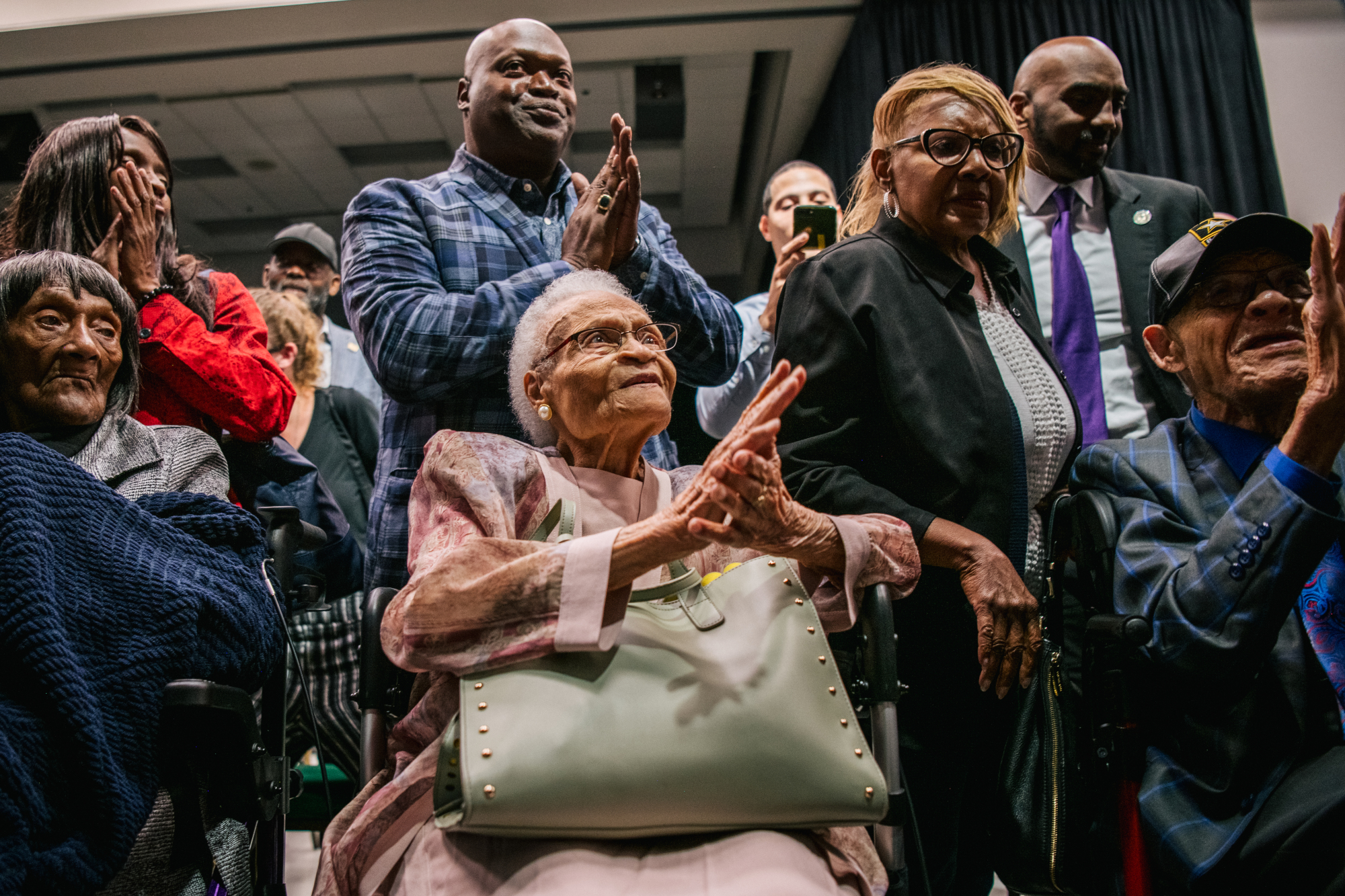 The three remaining survivors of the 1921 Tulsa Race Massacre, when a white mob set a Black community ablaze and killed hundreds of residents,  sing together at the conclusion of a rally during commemorations of the 100th anniversary of the massacre on June 1 in Tulsa, Oklahoma.