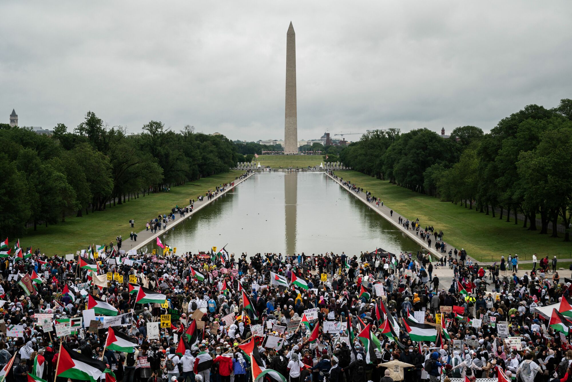 TOPSHOT - Supporters of Palestine hold a rally at the Lincoln Memorial in Washington, DC on May 29, 2021. - More than 1,000 rallied Saturday in Washington in support of  Palestinians and calling for an end to US aid to Israel. The demonstration on the steps of the Lincoln Memorial came as a ceasefire that ended 11 days of intense fighting between Israel and the Islamist movement Hamas in the Gaza Strip has so far held. (Photo by ANDREW CABALLERO-REYNOLDS / AFP) (Photo by ANDREW CABALLERO-REYNOLDS/AFP via Getty Images)