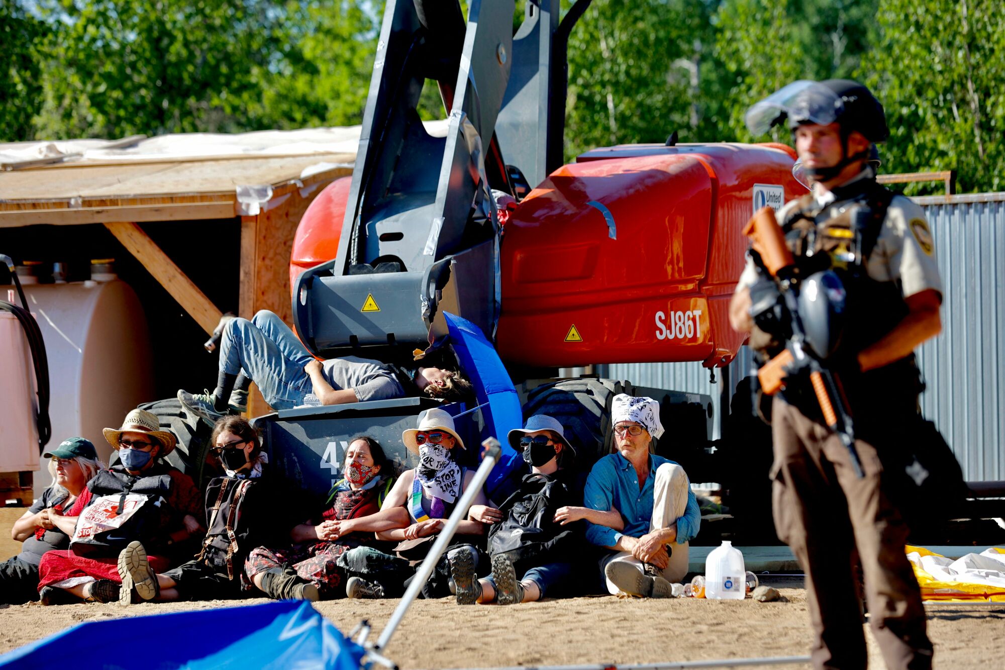 Police in riot gear arrest environmental activists at the Line 3 oil sands pipeline pumping station near the Itasca State Park, Minnesota on June 7.