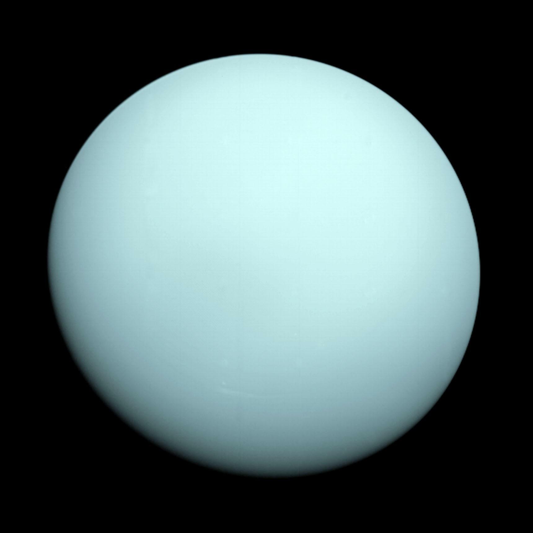 NASA's Voyager spacecraft traveled past Uranus in 1986, capturing its blue-green profile from 7.8 million miles away.